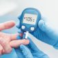 Doctor checking blood sugar level with glucometer. Treatment of diabetes concept.